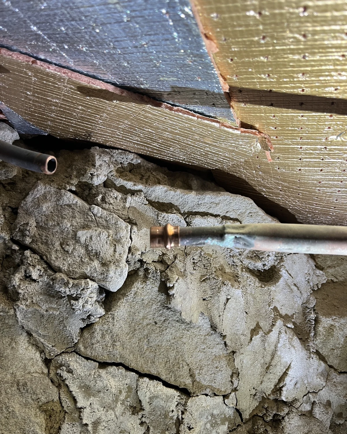 Capped pipework beneath flooring during a Peach Plumbing job